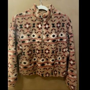 Cropped style teddy fleece pullover.